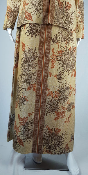 Lower front view of the two-piece set showing the matching vertical Greek-key borders on the jacket and maxi dress vintage in the 1970s Alfred Shaheen Gold Metallic Floral Maxi Dress & Jacket Set 