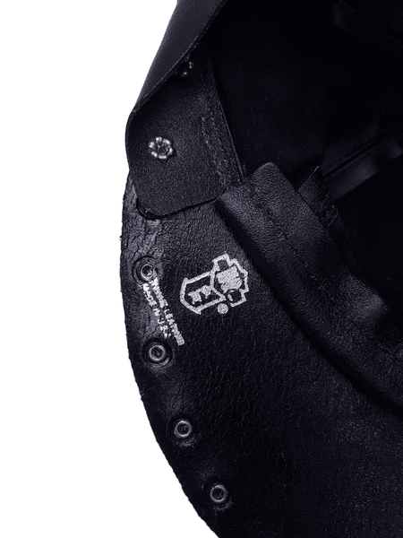 Interior view showing the underside of the cap, and the manufacturers stamp, made in USA