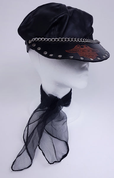 Three quarter view of Black biker cap styled on a mannequin with a Harley-Davidson emblem, studded peak and silver-tone chain