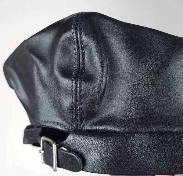 Rear view showing the adjustable buckle strap and purple ink marks along the crown seam