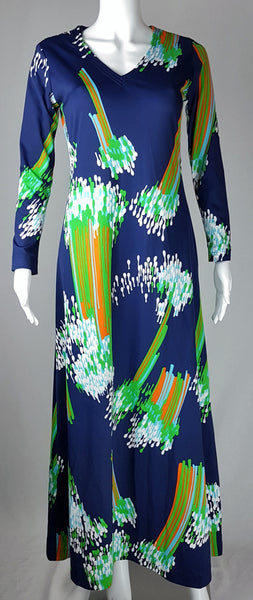 Full front view of a vintage 1970s Lanvin navy maxi dress with a V-neck, long sleeves and a vivid abstract print displayed on a mannequin