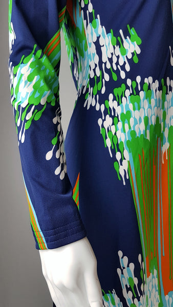 Close-up of the long narrow sleeve, stitched cuff and colourful streak-and-droplet print on a vintage 1970s Lanvin dress.