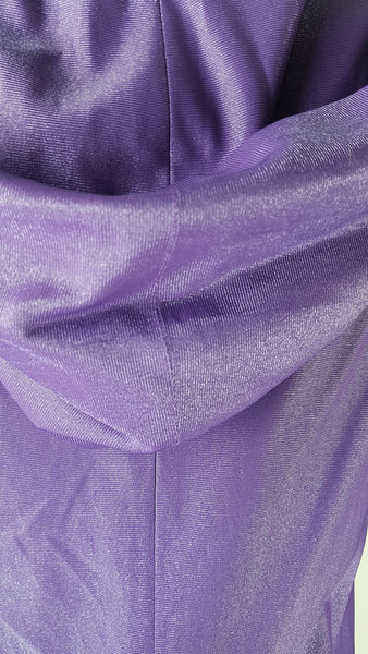 Back Hood view of a 1970s Nu-Mode purple jumpsuit with a draped hood, V-neckline, front zip and ties, long sleeves and wide legs displayed on a mannequin 