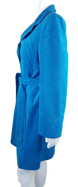 Side view of a vintage 1970s turquoise faux-suede coat with oversized lapels, buttons and matching tie belt