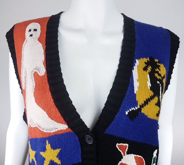 Upper front detail showing the deep ribbed V-neck, white ghost and witch flying across a yellow moon