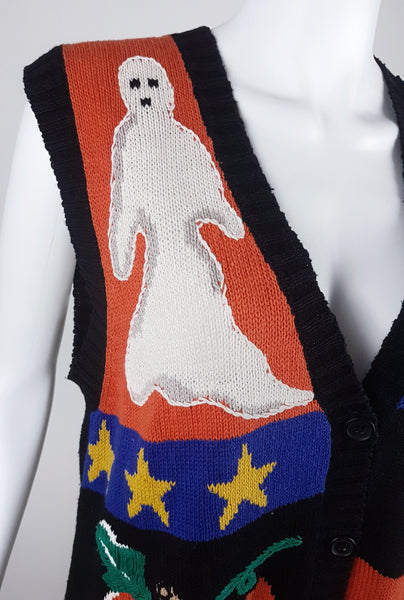 Close-up of the white ghost motif with embroidered facial details and yellow stars below
