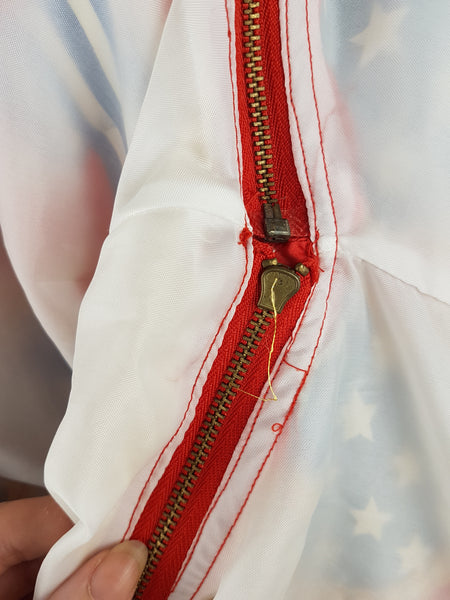Closeup of detachable inner sleeve zipper view of a Vintage 1980s - 1990s Mureli silk bomber jacket 