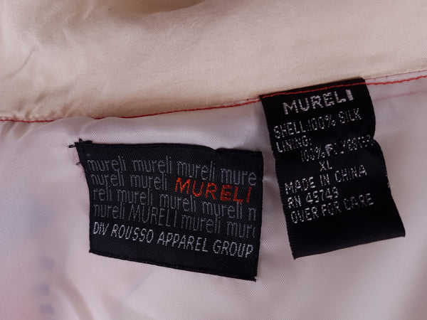 Closeup view of sizing label on a Vintage 1980s - 1990s Mureli silk bomber jacket 
