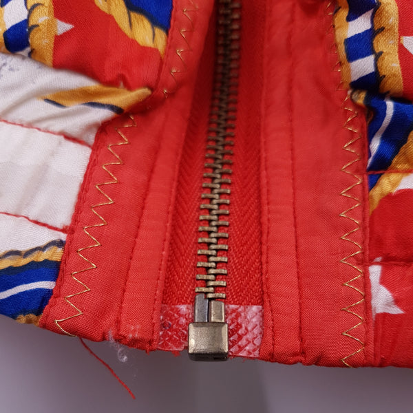 Closeup view of front zipper of a Vintage 1980s - 1990s Mureli silk bomber jacket 