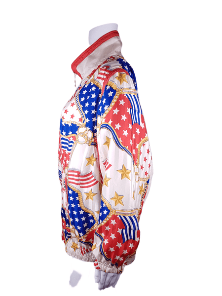 Full side view of a Vintage 1980s - 1990s  Mureli silk bomber jacket with a red, white, blue and gold USA flag and chain print, detachable sleeves, red trim and an oversized blouson silhouette, displayed on a mannequin