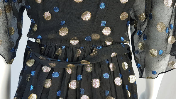 Close-up of the elasticated back waist and matching tie belt on a Vintage 1980s Edith Strauss Black Silk Metallic Polka-Dot Midi Dress displayed on a mannequin