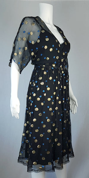 Full three quarter view of a Vintage 1980s Edith Strauss Black Silk Metallic Polka-Dot Midi Dress displayed on a mannequin