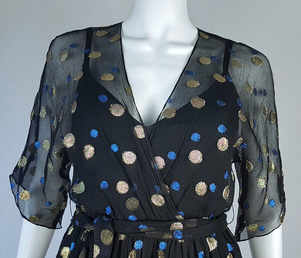 Close-up front view of the sleeves, elasticated front waist, matching tie belt and bodice on a Vintage 1980s Edith Strauss Black Silk Metallic Polka-Dot Midi Dress displayed on a mannequin