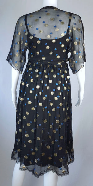 Full back view of a Vintage 1980s Edith Strauss Black Silk Metallic Polka-Dot Midi Dress displayed on a mannequin