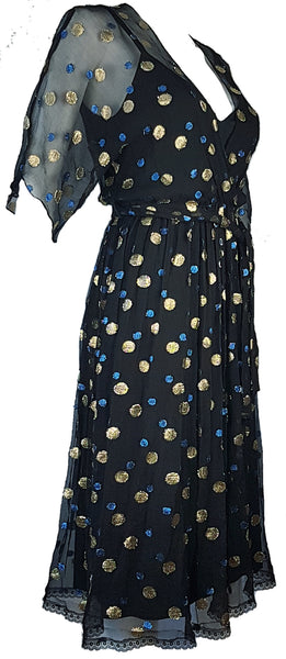 Full three quarter view of a Vintage 1980s Edith Strauss Black Silk Metallic Polka-Dot Midi Dress displayed on a mannequin
