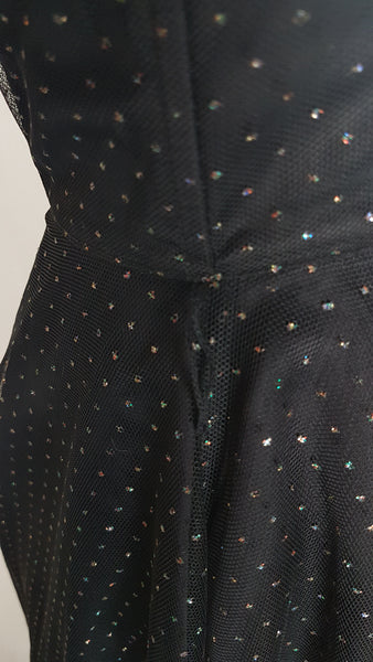 Closeup waistline view of a vintage 1980's Gunne Sax black formal dress with multicolor glitter dot overlay and a pleated tulle sweetheart neckline