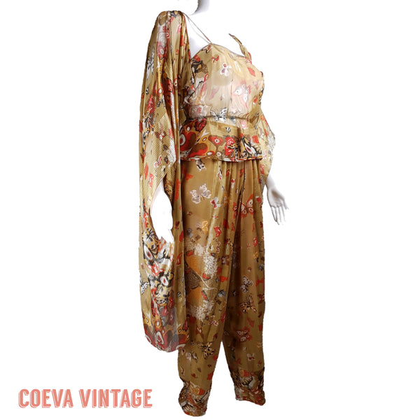 Three-quarter view of a vintage 1980s Soo Yung Lee gold metallic silk three-piece set with a draped kaftan, camisole and tapered trousers displayed on a mannequin