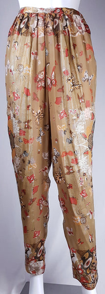 Full front view of vintage 1980s Soo Yung Lee gold metallic silk trousers with a fitted waistband, gathered hips and tapered legs.