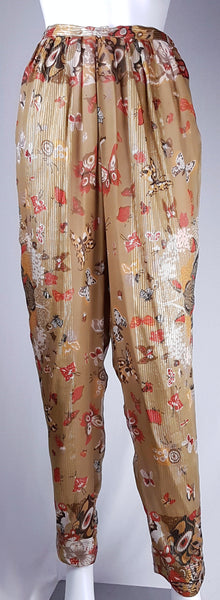 Full front view of vintage 1980s Soo Yung Lee gold metallic silk trousers with a fitted waistband, gathered hips and tapered legs.