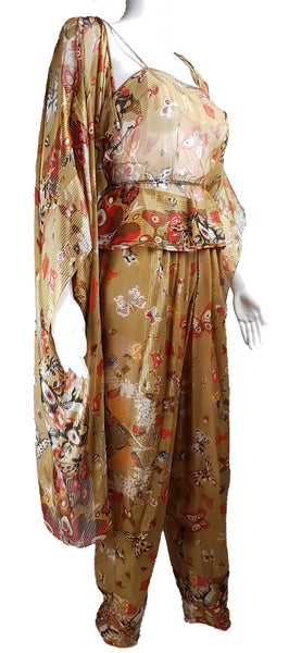 Three-quarter view of a vintage 1980s Soo Yung Lee gold metallic silk three-piece set with a draped kaftan, camisole and tapered trousers displayed on a mannequin