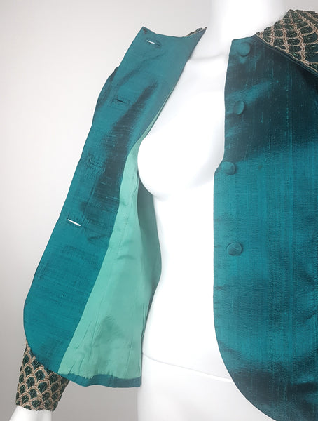 Open front view of the Spaghetti London jacket showing its pale-jade lining, silk facings, loop fastenings and covered buttons.