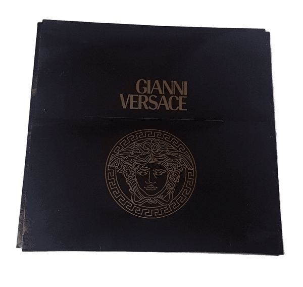 Back view of Original vintage 1990s Atelier Versace presentation folder in black featuring the Gianni Versace name and Medusa head in gold 
