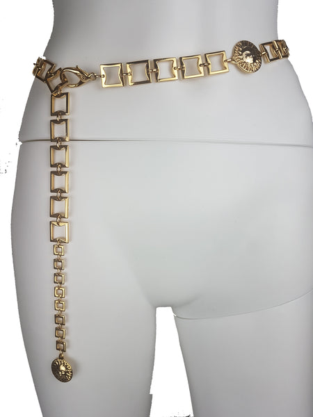 Gianni Versace Profumi chain belt worn at the waist with its adjustable linked end hanging over the hip, displayed on a mannequin