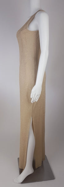 Full side view of a vintage 1990s LA Glo gold lurex evening gown, showing its one-shoulder neckline and high side slit.