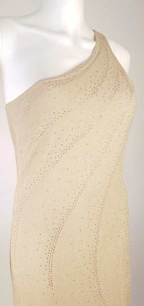 Three-quarter view of the fitted bodice on a vintage 1990s LA Glo one-shoulder gown with curved lines of gold glitter dots.