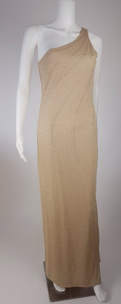 Full front view of a vintage 1990s LA Glo champagne-gold lurex one-shoulder evening gown with a fitted floor-length column silhouette displayed on a mannequin