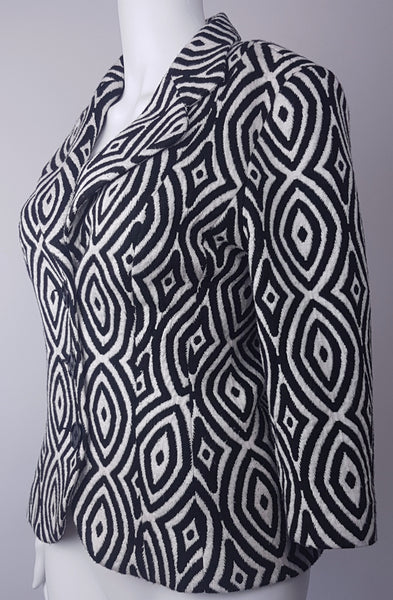 Full front three quarter view of a vintage 1990s Le Château black-and-white op-art jacket with notched lapels and a three-button closure displayed on a mannequin