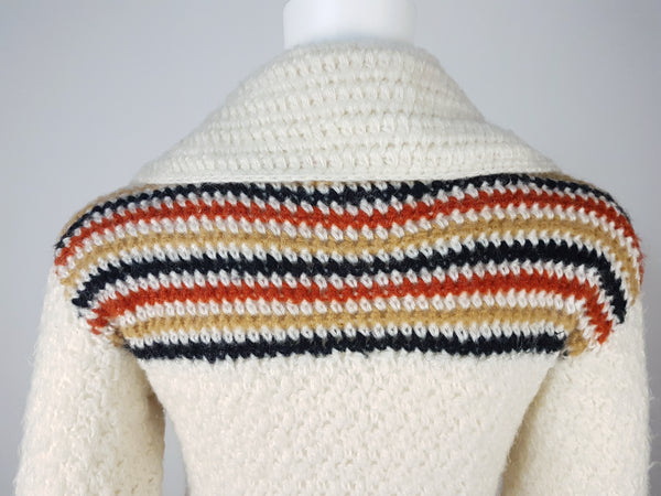 Collar and shoulder of  vintage 1990's Leroy Knitwear cream cardigan sweater with deer motifs and wooden buttons, displayed on a mannequin.
