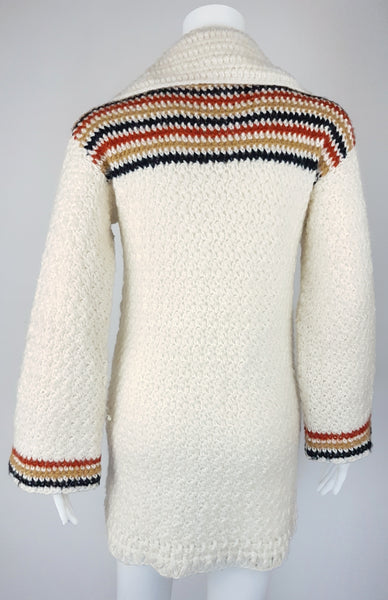 Back view of a vintage 1990's Leroy Knitwear cream cardigan sweater with deer motifs and wooden buttons, displayed on a mannequin.