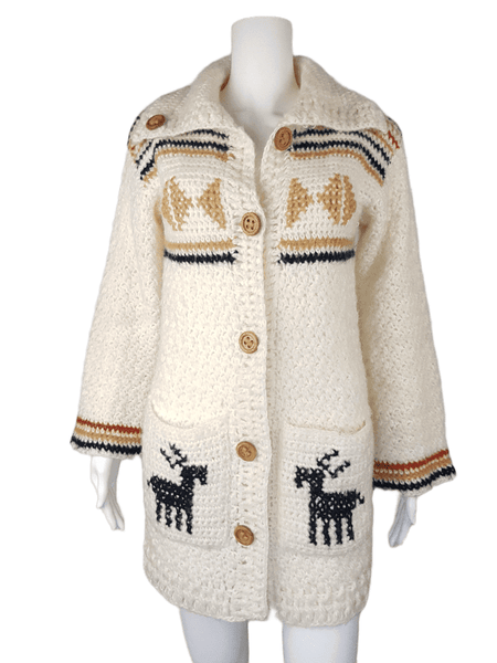 A vintage 1990's Leroy Knitwear cream cardigan sweater with deer motifs and wooden buttons, displayed on a mannequin.