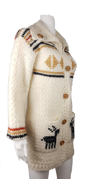 A vintage 1990's Leroy Knitwear cream cardigan sweater with deer motifs and wooden buttons, displayed on a mannequin.