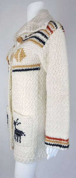 Side view of a vintage 1990's Leroy Knitwear cream cardigan sweater with deer motifs and wooden buttons, displayed on a mannequin.