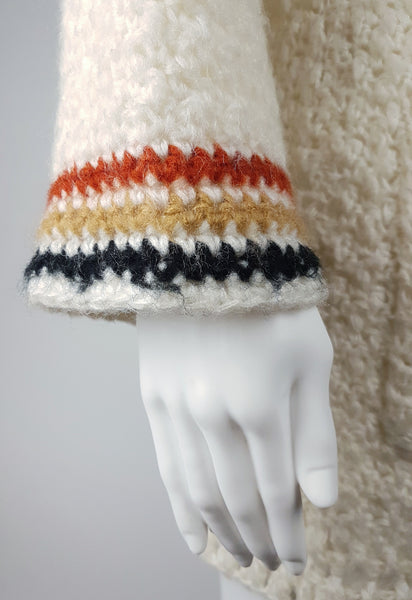 Sleeve detail closeup on a a vintage 1990's Leroy Knitwear cream cardigan sweater displayed on a mannequin.