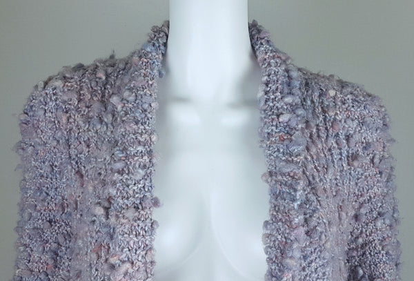 Close-up of the wide rolled neckline and textured open front on a Vintage 1990s Pastel Popcorn-Knit Open-Front Cardigan displayed on a mannequin