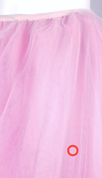 circled in red close-up view of the small hole in fabric on a vintage 1990s RALPH Ralph Lauren pink tulle maxi skirt with a voluminous layered A-line silhouette displayed on a mannequin
