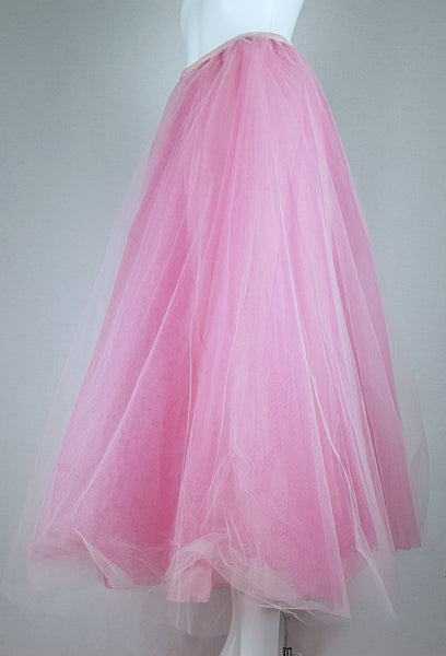Full side view of a vintage 1990s RALPH Ralph Lauren pink tulle maxi skirt with a voluminous layered A-line silhouette displayed on a mannequin