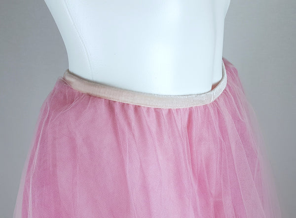 Close-up front view of the narrow elastic waistband and layered pink tulle on a vintage 1990s RALPH Ralph Lauren maxi skirt displayed on a mannequin