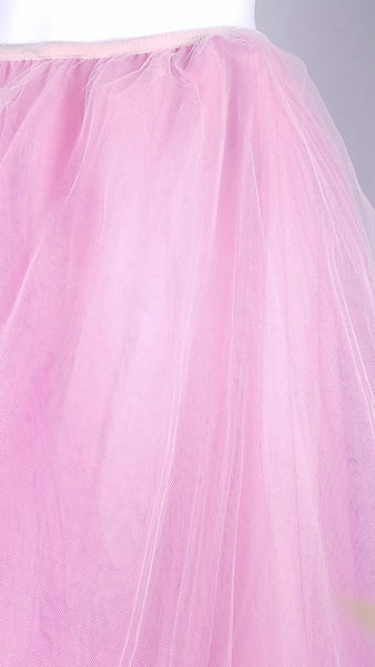 Close-up view of the small hole in fabric on a vintage 1990s RALPH Ralph Lauren pink tulle maxi skirt with a voluminous layered A-line silhouette displayed on a mannequin