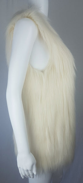 Full side view of a cream long-pile faux-fur vest with a collarless neckline, decorative fastening and side pockets displayed on a mannequin