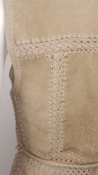 Close-up view of a vintage 60s - 70s Hudson Bay Company vests rear waist showing the vertical crochet panel join, openwork waistband and braided belt.