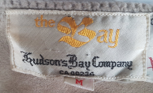 Close-up of the woven label reading the Bay, Hudson Bay Company, CA 00234 and size M.