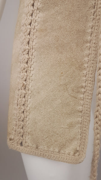  Close-up of a vintage 60s - 70s Hudson Bay Company vest lower suede panel showing the crochet borders, natural nap and scattered age-related marks.