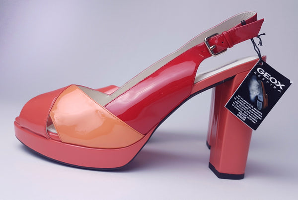 Side view of unworn Geox Respira colour-block platform sandals in red, coral and peach, with crossover peep toes, block heels and buckled slingback straps.