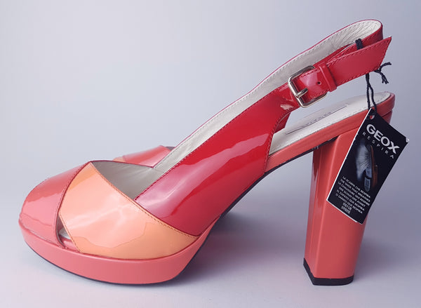 Side view of unworn Geox Respira colour-block platform sandals in red, coral and peach, with crossover peep toes, block heels and buckled slingback straps.