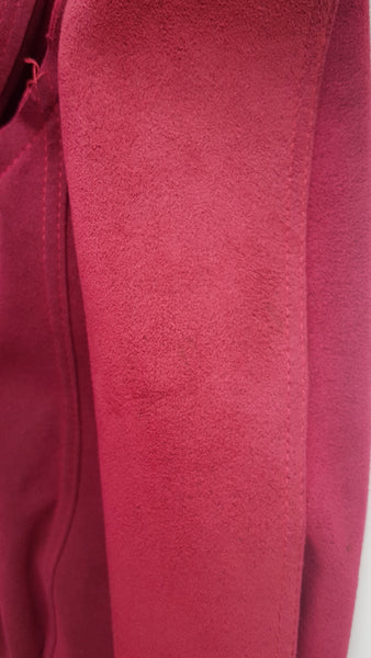 sleeve closeup of Vintage 1970's Halston Ultra Suede red knee length wrap coat dress with long sleeves, a wide collar, and a matching tie belt on a mannequin 