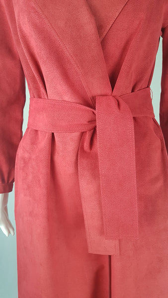 Tie belt view on Vintage 1970's Halston Ultra Suede red knee length wrap coat dress with long sleeves, a wide collar, and a matching tie belt on a mannequin 